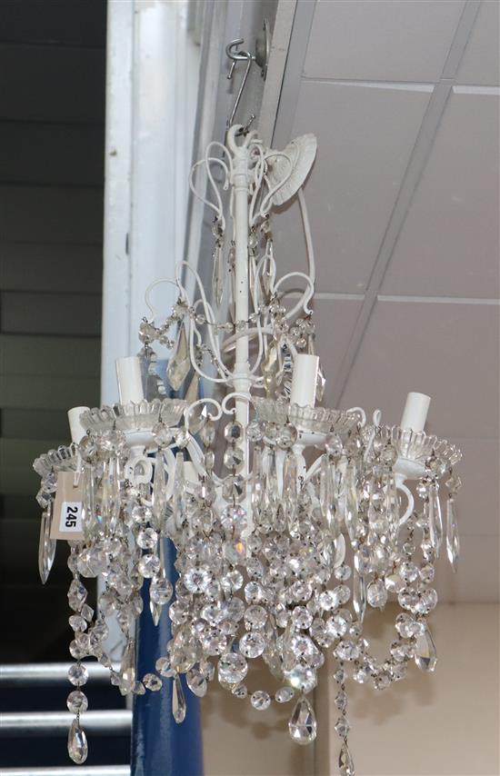 A six branch white painted electrolier with hung cut glass drops